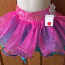 Hot pink tutu skirt with sequin waistband and white flower