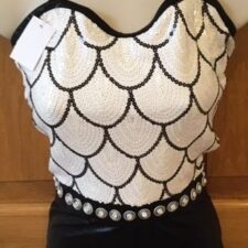 Black and white sequin biketard with scallop pattern and leather look shorts