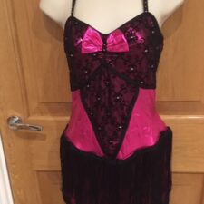 Metallic pink and black fringed leotard with large back bow